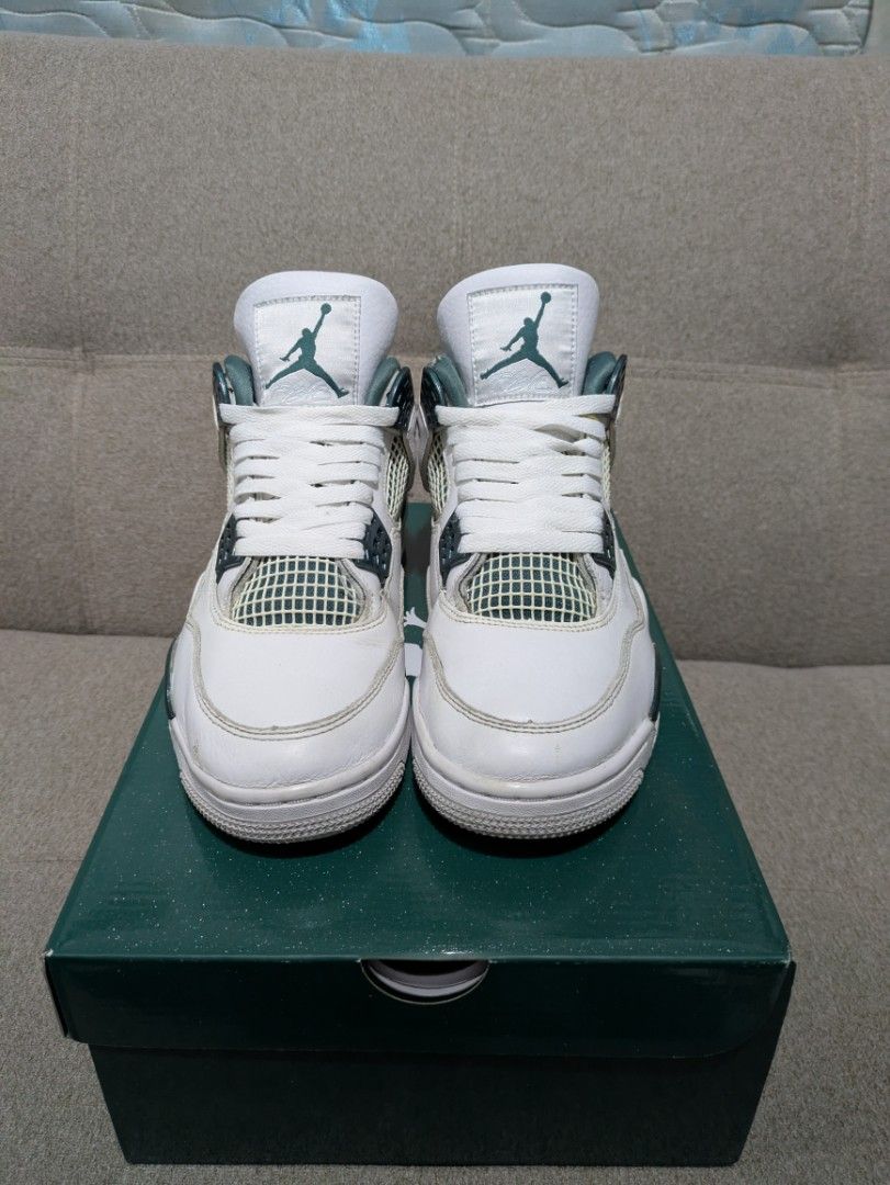 Air Jordan 4 Retro Pine Green (Category: Sneakers) located in Manila. Submitted by neo921 (Listing ID 1434088412, Image 3). Description: - Air Jordan 4 Retro - Colorway: White and Pine Green - Size: US 8 - Features Jumpman logo - Includes original box - Minor wear and tear present.