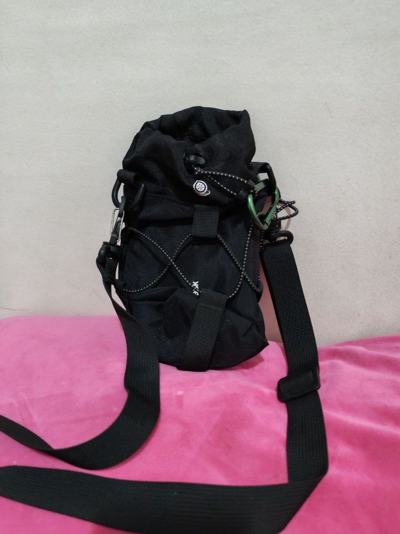AquaFlask Water Bottle Bag with Shoulder Strap (Category: Water Bottles & Tumblers) located in Manila. Submitted by christinet12769 (Listing ID 1434113285, Image 2). Description: - Black AquaFlask water bottle bag - Drawstring closure - Adjustable shoulder strap - Small loop for attachments - Includes carabiner clip - White accent stitching - AquaFlask logo visible.