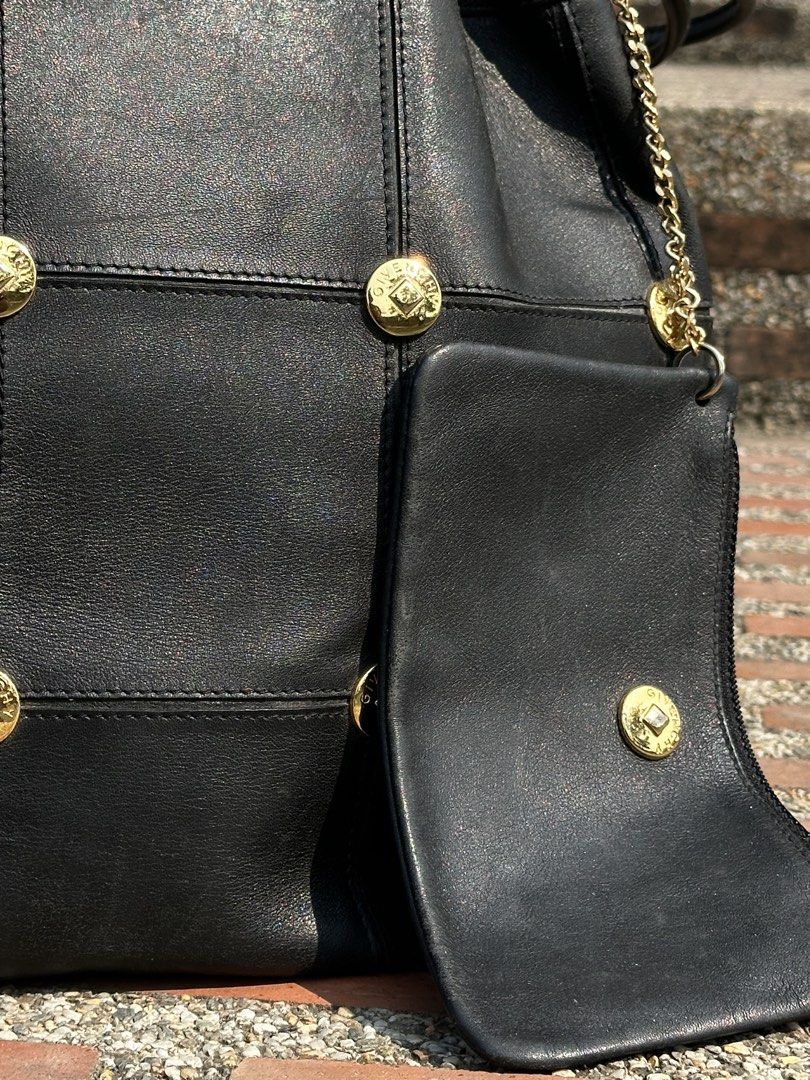 Archive GIVENCHY Studded Leather Bucket Bag with Pouch (Category: Luxury Bags & Wallets) located in Urdaneta. Submitted by redeemedcollective (Listing ID 1434074483, Image 3). Description: Rare archival Givenchy! A stunning "quiet luxury" piece in buttery black leather with gold-tone hardware. • Details: Iconic Givenchy-engraved studs, paneled leather construction, and drawstring closure. • Inclusions: Comes with the original matching leather zip