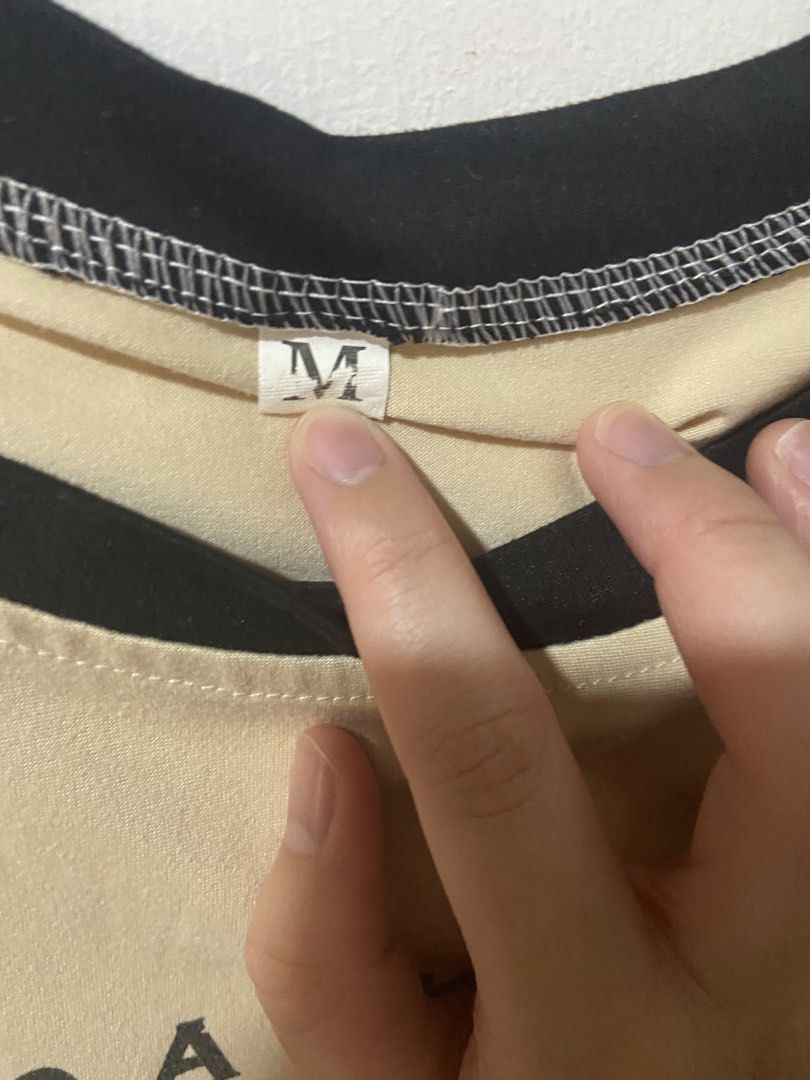 beige and black racing car crop top (Category: Shirts) located in Rosario. Submitted by vampkitsch (Listing ID 1434073173, Image 3). Description: rfs: decluttering | size: m (can fit s for slightly looser fit) from: orange app, no issues open for negotiation pm for more deets ♡.