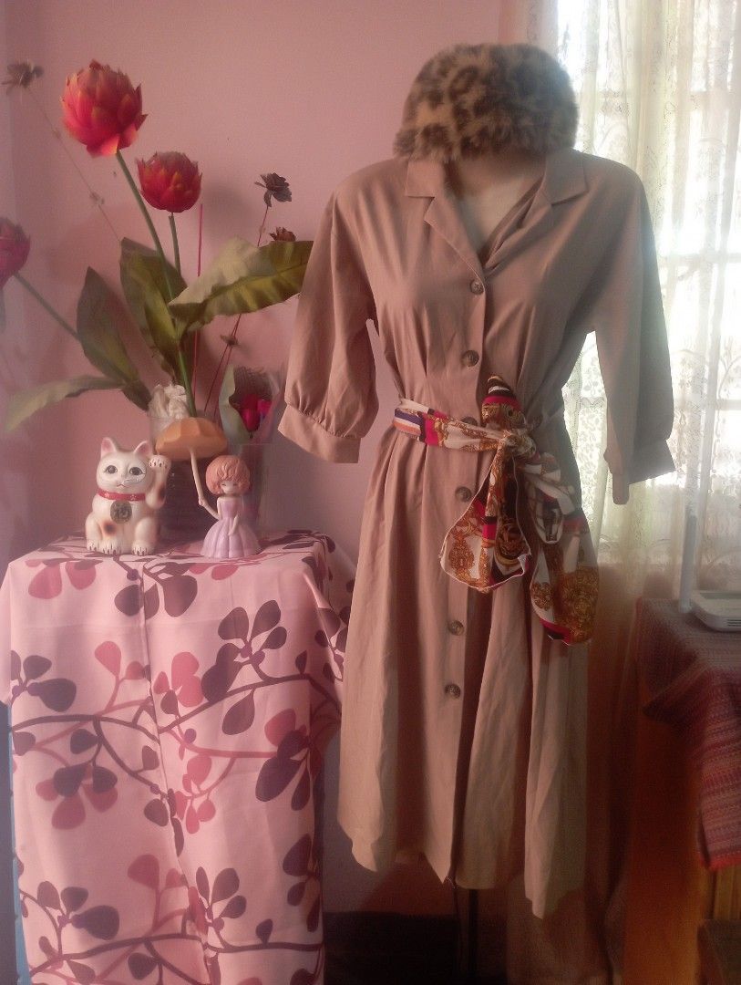 Beige Trench Coat with Belt (Category: Dresses) located in Manila. Submitted by Jessane23 (Listing ID 1434100099, Image 3). Description: - Elegant beige trench coat - Double-breasted design - Button closures - Matching belt with patterned scarf - Long sleeves - Classic trench coat silhouette - Adds sophistication.