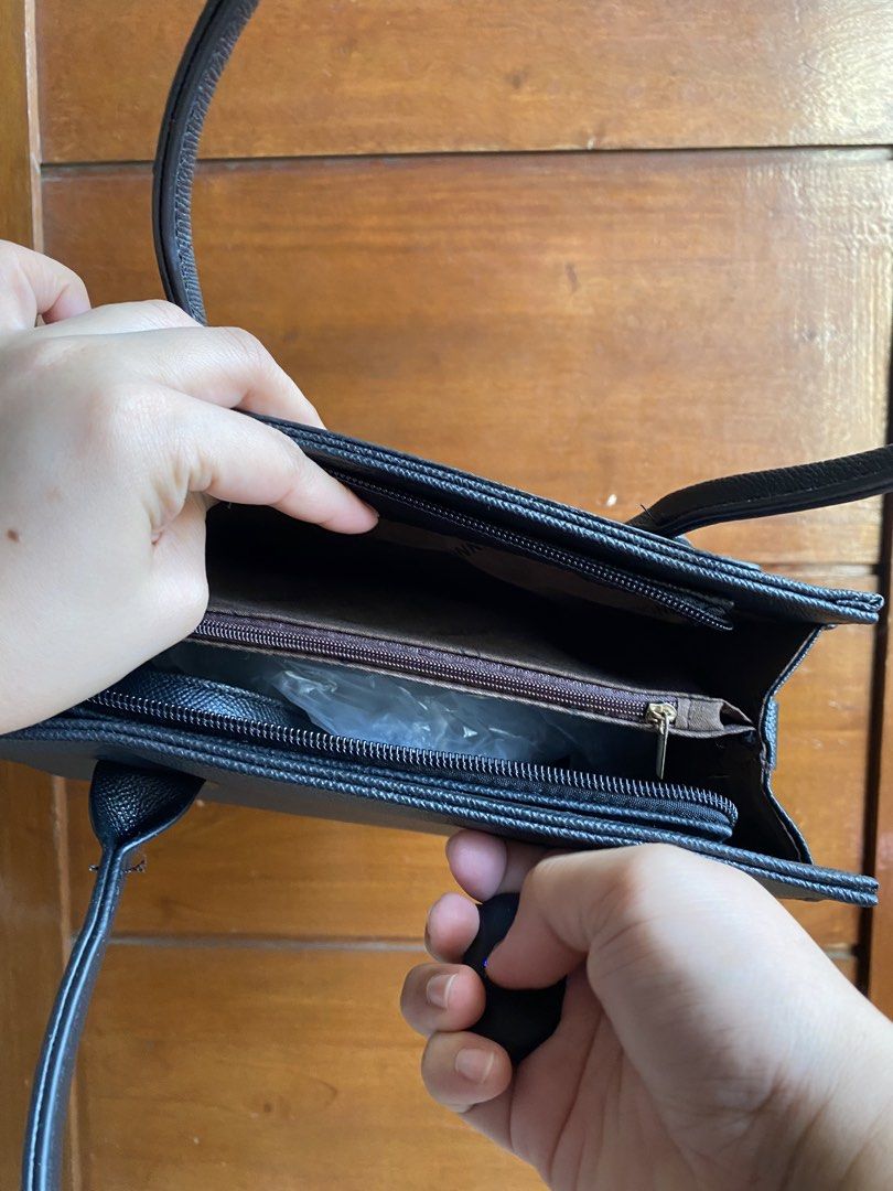 Belladonna Black Handbag (Category: Shoulder Bags) located in Manila. Submitted by nicat205 (Listing ID 1434022738, Image 3). Description: - Black Belladonna handbag - Top handle design - Gold-colored clasp closure - Interior zippered pocket - Includes original tags - Selling Price: ₱599.00 (Original Price: ₱1199.00) - Perfect for everyday use.