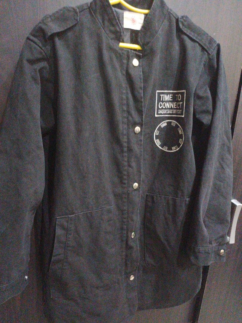 Black Denim Coat/Jacket with Patches (Category: Coats, Jackets and Outerwear) located in Manila. Submitted by ggarage.sale (Listing ID 1434077226, Image 1). Description: - Black denim button-up jacket/Coat - Features two front pockets - Includes a "Time to Connect" chest patch - Classic collar and shoulder epaulettes - Plain black back - Made of sturdy material.