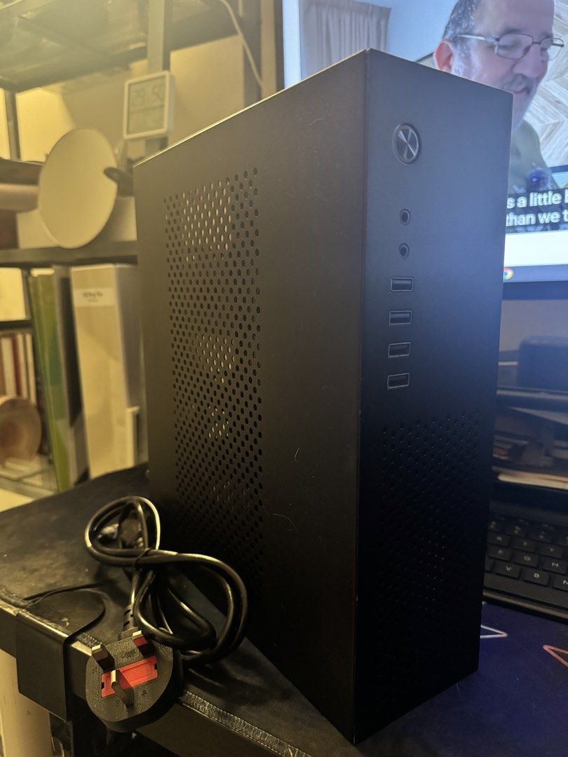Black PC Case (Category: Computer Parts) located in Subang Jaya. Submitted by mrkerusi (Listing ID 1434138363, Image 1). Description: - Black PC case - Perforated front panel for improved airflow - Front-facing ports: audio, USB, power button - Includes PSU - Internal mounting brackets - Clean, minimalist design.