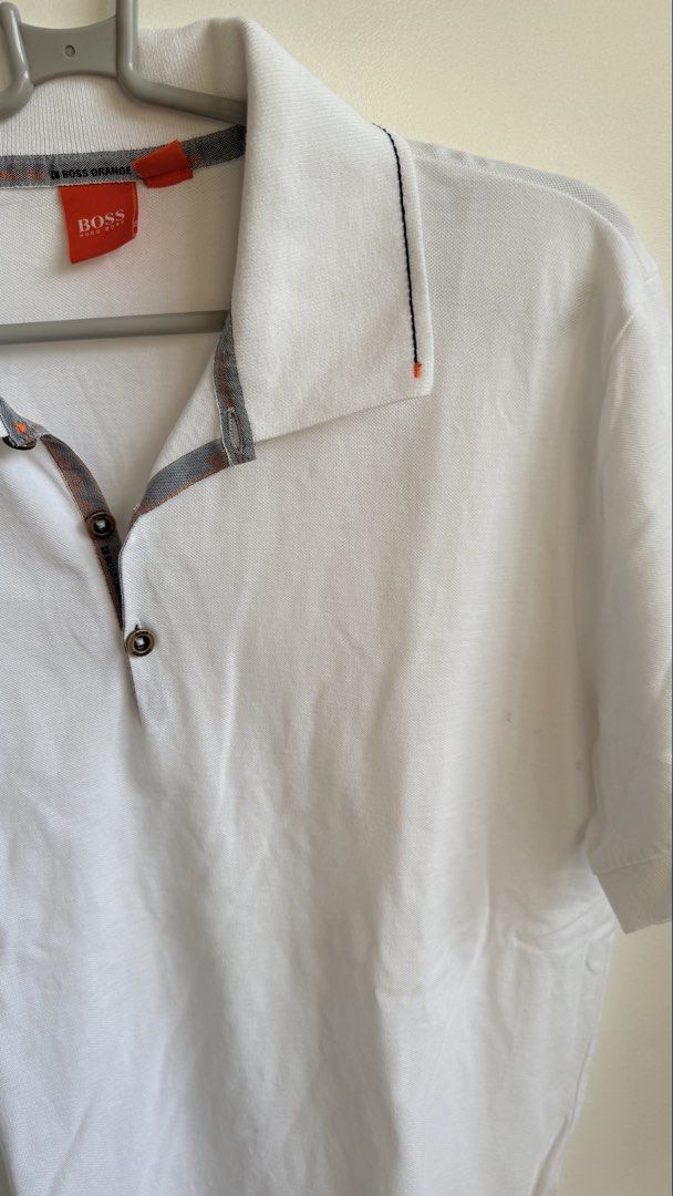 BOSS Orange White Polo Shirt (Category: Tshirts & Polo Shirts ) located in Valenzuela. Submitted by dees.corner (Listing ID 1434059963, Image 2). Description: - BOSS Orange polo shirt - Size L - Collared neckline with button closure - Orange and grey trim on collar and sleeves - Short sleeves - Small logo detail on sleeve - Made in Turkey - W17 L27.