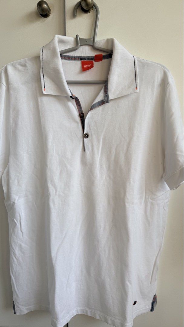 BOSS Orange White Polo Shirt (Category: Tshirts & Polo Shirts ) located in Valenzuela. Submitted by dees.corner (Listing ID 1434059963, Image 1). Description: - BOSS Orange polo shirt - Size L - Collared neckline with button closure - Orange and grey trim on collar and sleeves - Short sleeves - Small logo detail on sleeve - Made in Turkey - W17 L27.