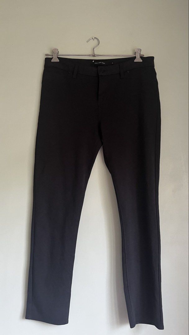 Calvin Klein Jeans Black Pants Size 14 (Category: Jeans) located in Pasig City. Submitted by detneedsmoney (Listing ID 1434033130, Image 1). Description: Black Calvin Klein Jeans pants. Size 14. Made in Vietnam. Waist measures approximately 17 inches across. Inseam is about 35 inches. The hem is approximately 6 inches. Features a button closure and pockets. A classic and versatile addition to your wardrobe..