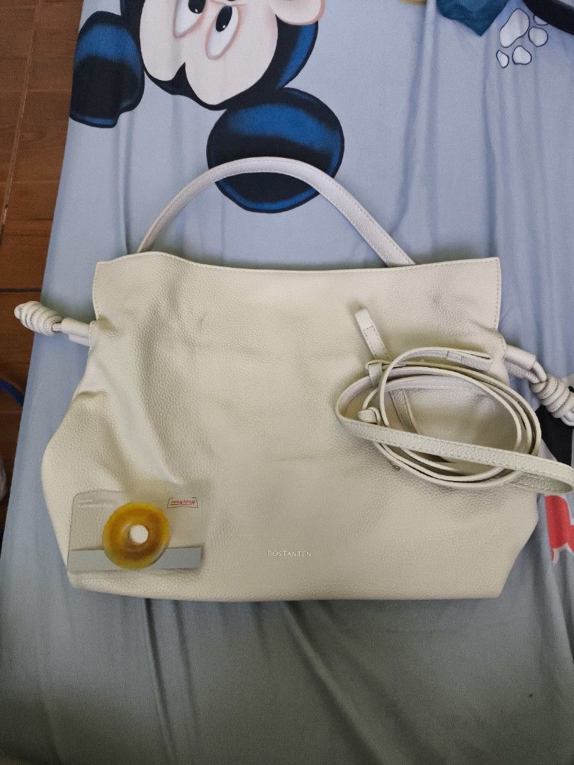 BOSTANTEN Cream Handbag with Shoulder Strap (Category: Luxury Bags & Wallets) located in Manila. Submitted by ad002021 (Listing ID 1434040955, Image 2). Description: Cream-colored handbag with detachable strap. Features top handle, knotted sides, and a dark interior. removable marks. 💚Bundle deals available—Willing to negotiate fairly if buying multiple items from my other listings ☺️ 🙏🏼I’m open to reasonable offers—happy to haggle a bit so we