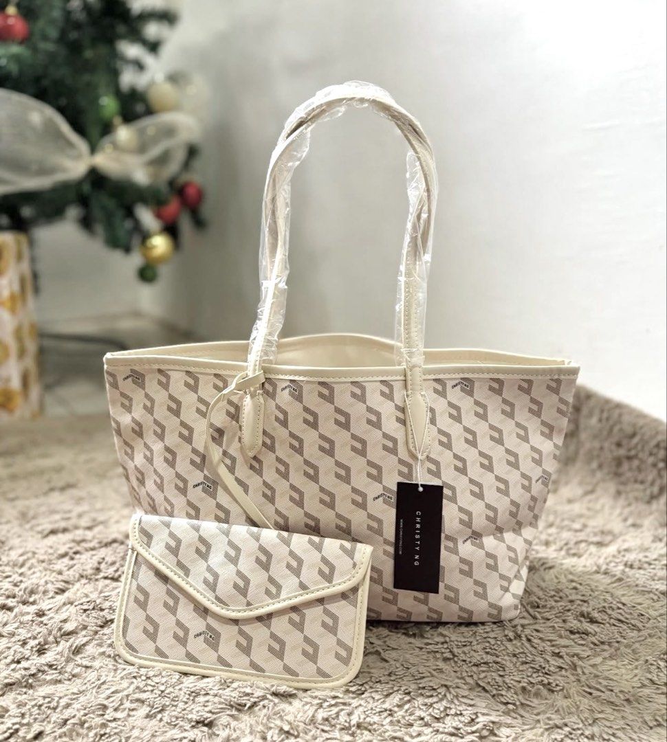 Christy Ng Russo Large Tote Bag (Category: Tote Bags) located in Bulacan. Submitted by mykakarizza (Listing ID 1434068796, Image 1). Description: NEW COLOR BEIGE ✨✨ ₱750 now Christy Ng Russo Tote Bag Pouch included Size: 12.5" (L) x 8.7" (H) x 5.2" (W) Add CN paperbag 100 📸 Actual pics! 🙋🏻‍♀️ **other colors available: Black, Namemulti, Gray, Green, Pink, White, Maroon, Beige (Brown not available now).