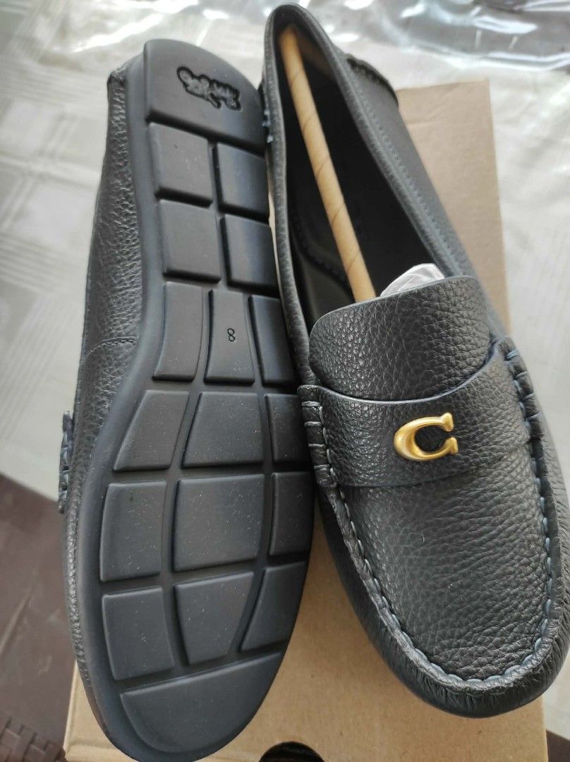 Coach navy blue Leather Loafers (Category: Loafers) located in General Mariano Alvarez. Submitted by deslacbayan (Listing ID 1434029297, Image 2). Description: - Coach black leather loafers - New with original box - Classic design - Gold-tone 'C' logo detail - Textured leather finish - Suitable for everyday or dressy wear.