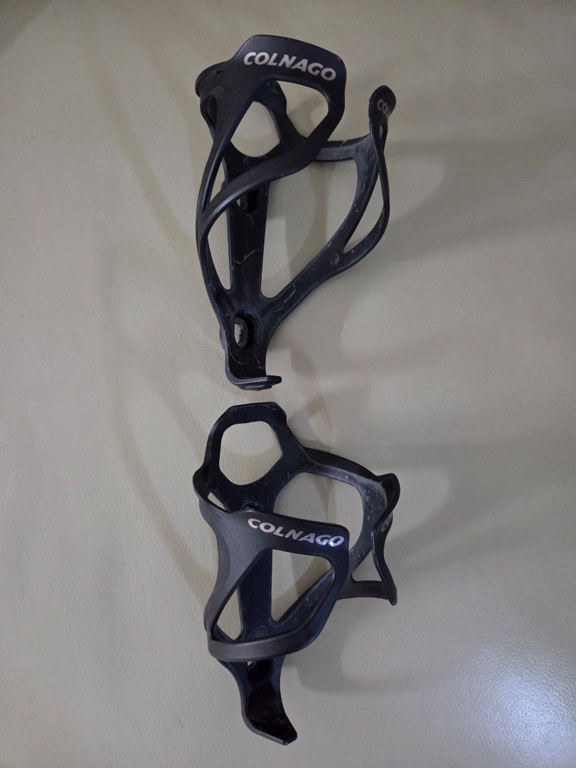 Colnago BC02 Carbon Bottle Cage, 2pcs (Category: Parts & Accessories) located in Singapore. Submitted by Prism (Listing ID 1434092544, Image 2). Description: Selling both for $59, retailed at $150 Comes with nuts and bolts.