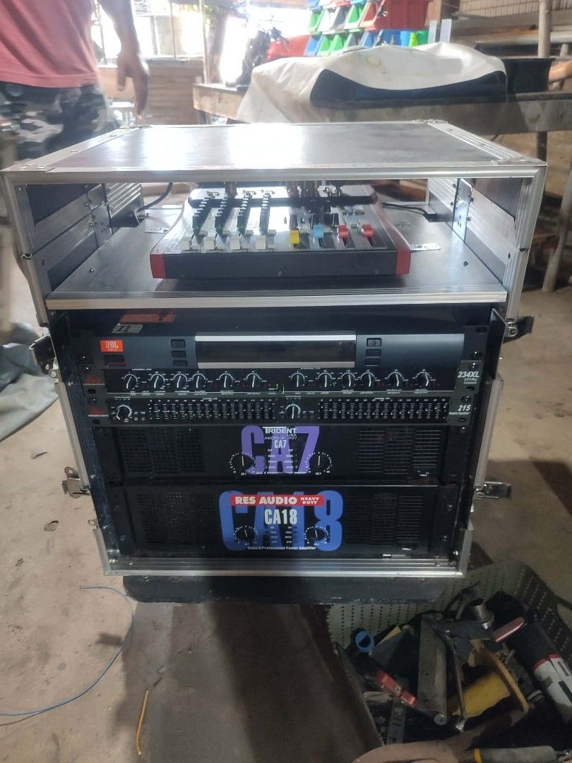 Complete Sound System with Mixer and Speakers (Category: Soundbars, Speakers & Amplifiers) located in Manila. Submitted by ilanomiche57784 (Listing ID 1434029755, Image 2). Description: - Complete sound system package - Includes: - Mixer - Power Amplifier - Equalizer - Two Titan Speakers - One Additional Speaker - Housed in a rolling rack case for easy transport and setup - Ideal for events and personal use.