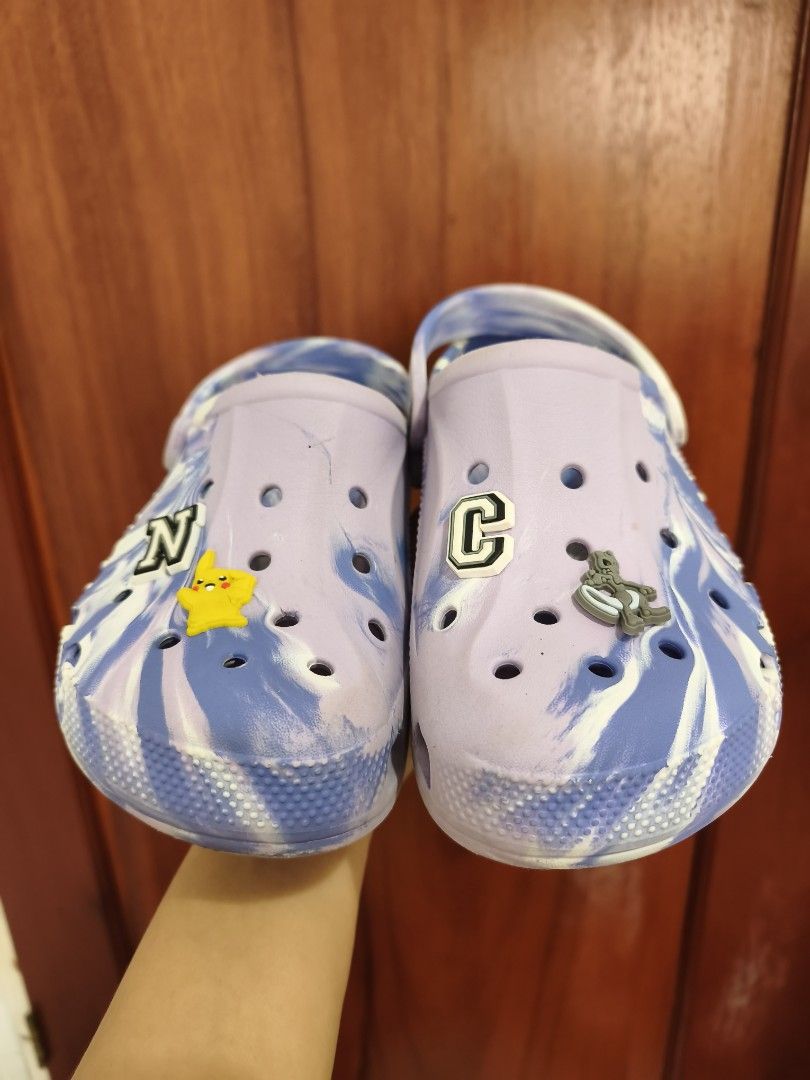 Crocs Bayaband Clog Marble (Category: Flats & Sandals) located in Batac City. Submitted by cletzdeclutter (Listing ID 1434070046, Image 2). Description: VERY LOW OFFERS WILL BE IGNORED - Preloved Original Crocs Clogs - Unique purple and blue tie-dye pattern - Includes decorative Jibbitz charms - Size J3 (22cm) - Soles show some wear Refer to photos for the item's condition Please manage expectations when buying preloved items. Bawal sa maseselan/