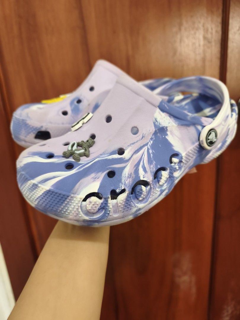 Crocs Bayaband Clog Marble (Category: Flats & Sandals) located in Batac City. Submitted by cletzdeclutter (Listing ID 1434070046, Image 1). Description: VERY LOW OFFERS WILL BE IGNORED - Preloved Original Crocs Clogs - Unique purple and blue tie-dye pattern - Includes decorative Jibbitz charms - Size J3 (22cm) - Soles show some wear Refer to photos for the item's condition Please manage expectations when buying preloved items. Bawal sa maseselan/