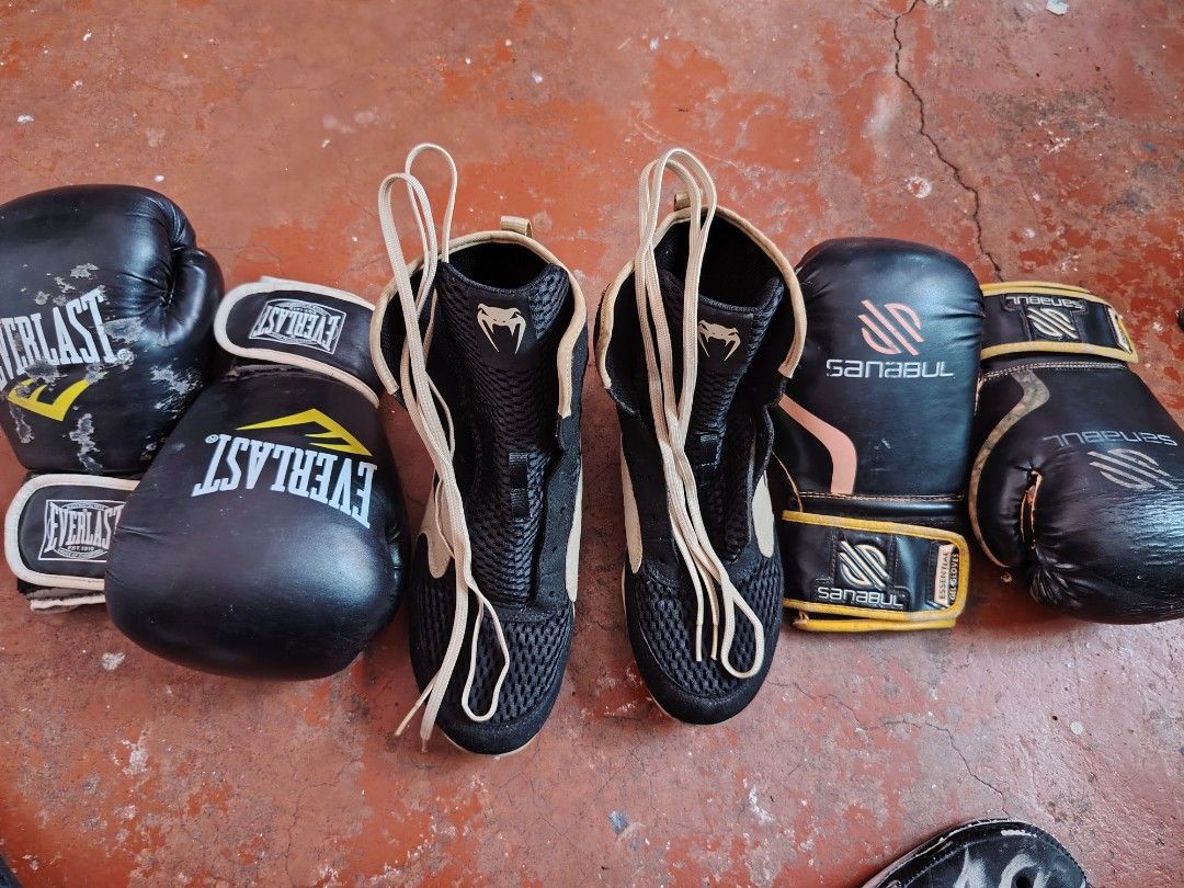 Everlast, Sanabul, Venum Boxing Gloves and Shoes (Category: Combat Sports) located in Manila. Submitted by ronivandel17414 (Listing ID 1434058279, Image 1). Description: - Boxing Gloves: - Brand: Sanabul - Size: 8 oz - Color: Black - everlast -12oz -black - Boxing Shoes: - Brand: Venum - Size: US 9.5, UK 8.5, EUR 42 1/2 - Color: Black and tan - Made in: China.