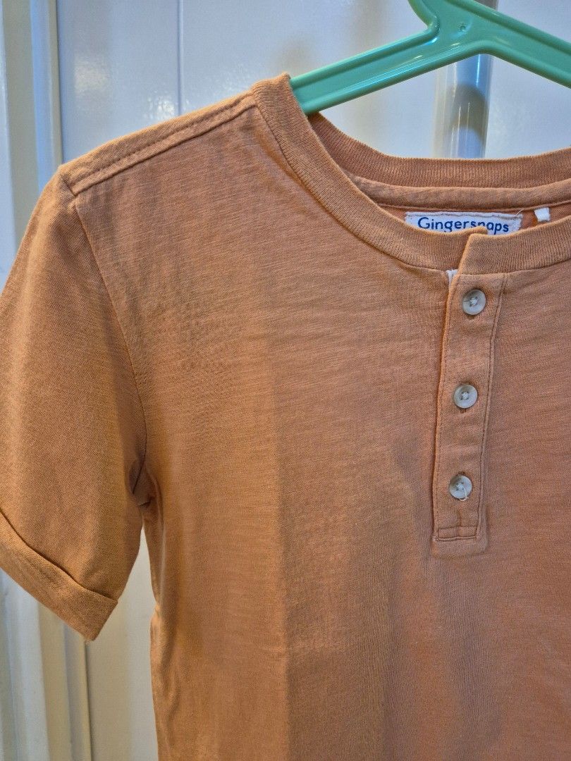 Gingersnaps Boys Henley Shirt - Size 6 (Category: Babies & Kids Fashion) located in Bacoor. Submitted by amdeocampo (Listing ID 1434028347, Image 2). Description: - Gingersnaps Boys Orange Henley Shirt - Size 6 - Short sleeves - Three-button placket - Crew neck - Pre-loved, please manage your expectations. There may be lint or slight discoloration due to washing..