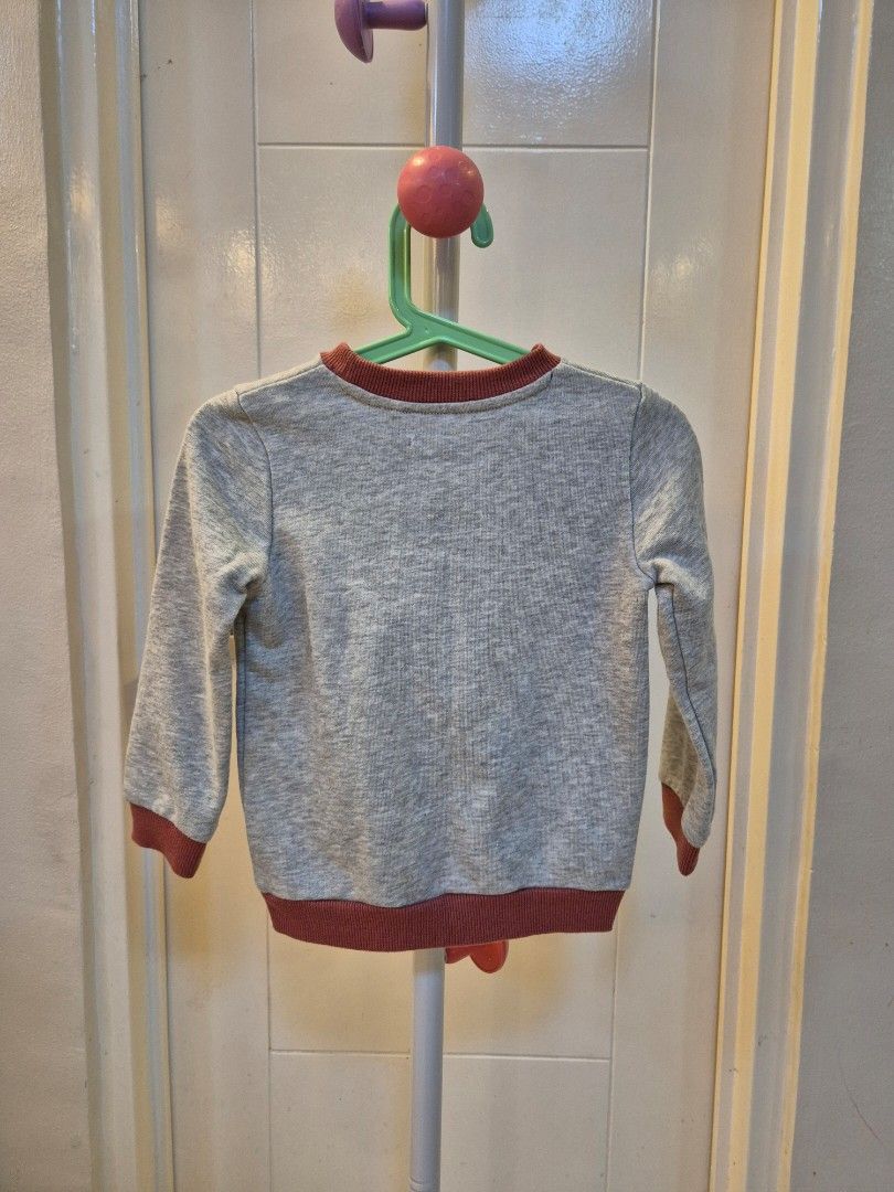 Gingersnaps Boys Tiger Sweatshirt Size 4 (Category: Babies & Kids Fashion) located in Bacoor. Submitted by amdeocampo (Listing ID 1434025309, Image 2). Description: - Gingersnaps Boys gray sweatshirt - Size 4 - Tiger graphic - Crew neck - Maroon ribbed cuffs - "Go Tigers!" and "Valley Cup Finals" print - Soft material - Pre-loved, please manage your expectations. There may be lint or slight discoloration due to washing..