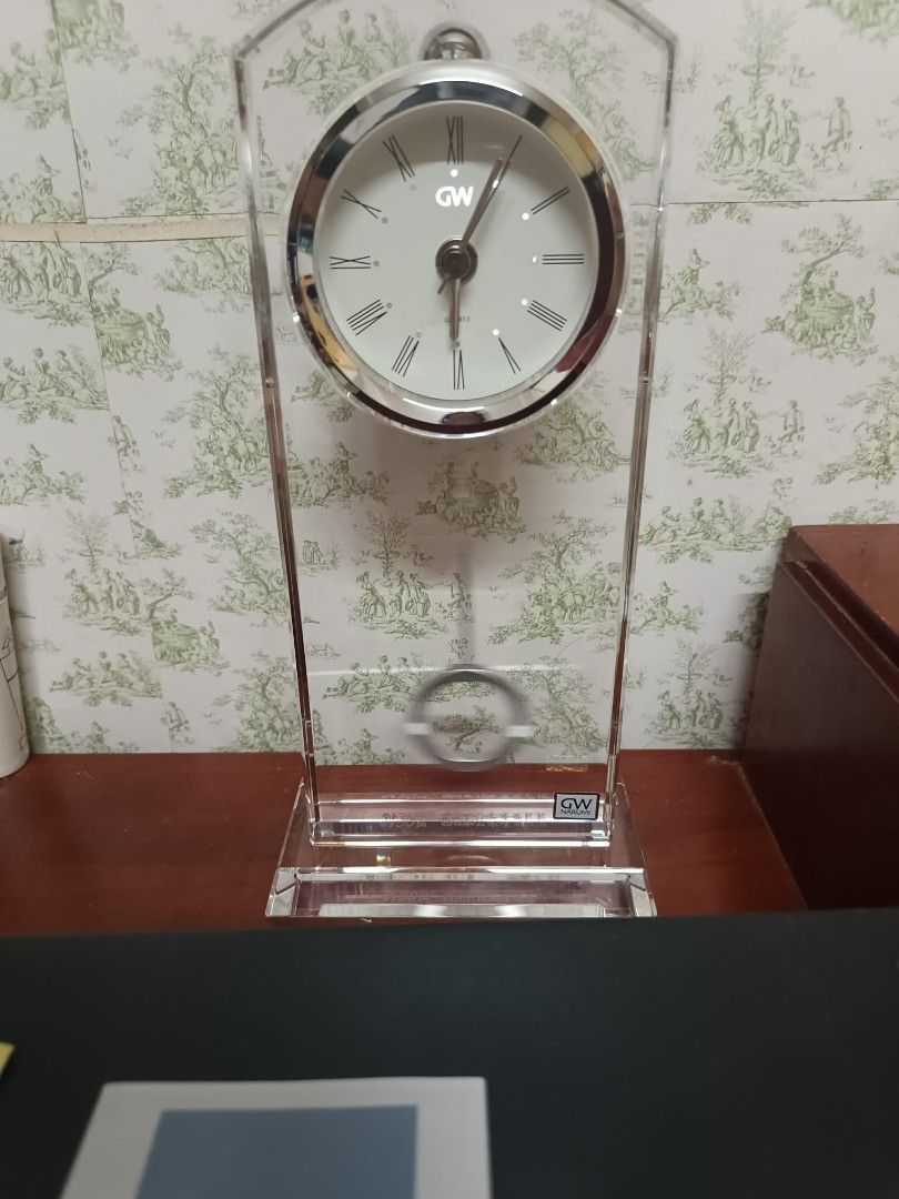 Glass Works Narumi Table Clock (Category: Clocks) located in Caloocan City. Submitted by chonadura91470 (Listing ID 1433977113, Image 3). Description: - Elegant Narumi table clock - Clear glass frame - Silver-toned clock face - Roman numeral hour markers brand-new with box - Narumi brand logo - Includes original box - Comes with paperwork - Perfect for desks or shelves.