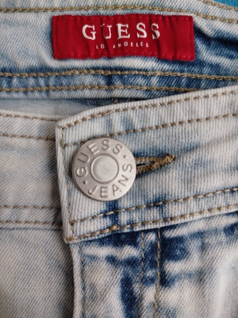 Guess Cut-off Denim Bermuda Shorts (Category: Shorts) located in Baguio. Submitted by nifty.grails (Listing ID 1434061855, Image 3). Description: W: 30 | L: 17 - Guess light acid wash denim shorts - Button closure with Guess Jeans logo - Two front and two back pockets - Guess logo on back pocket - Frayed hem - Made in China.