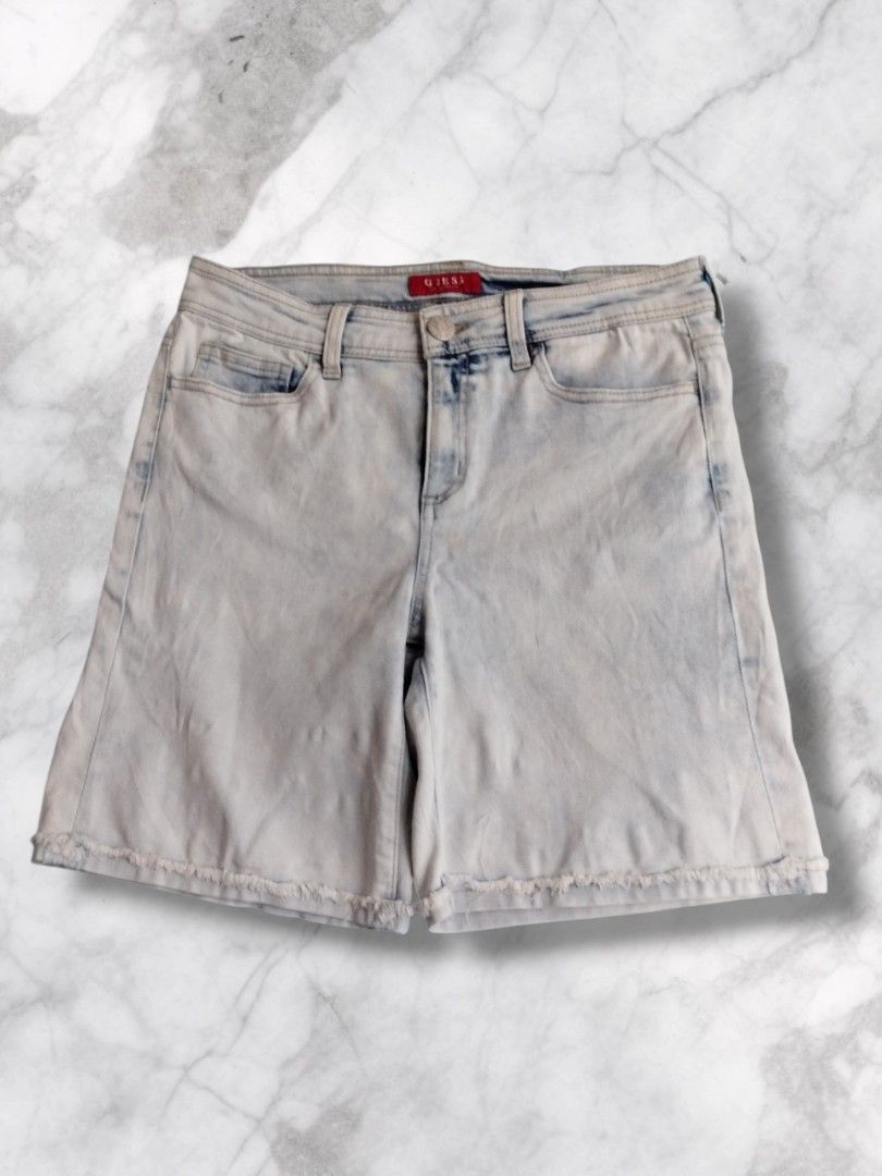 Guess Cut-off Denim Bermuda Shorts (Category: Shorts) located in Baguio. Submitted by nifty.grails (Listing ID 1434061855, Image 1). Description: W: 30 | L: 17 - Guess light acid wash denim shorts - Button closure with Guess Jeans logo - Two front and two back pockets - Guess logo on back pocket - Frayed hem - Made in China.