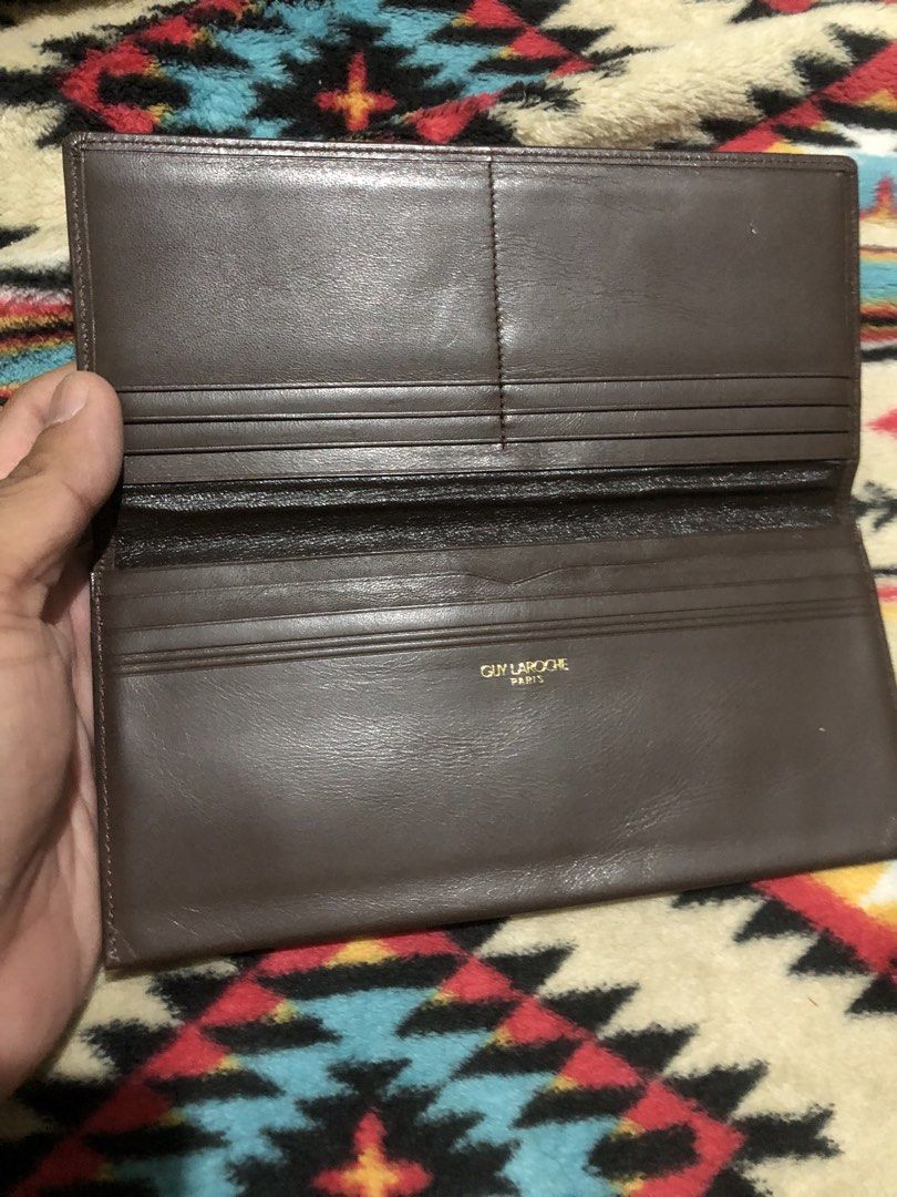 Guy Laroche Paris long dark brown leather wallet (Category: Wallets & Card Holders) located in Quezon City. Submitted by markgolveo (Listing ID 1434077231, Image 1). Description: Guy Laroche Paris long dark brown leather wallet.