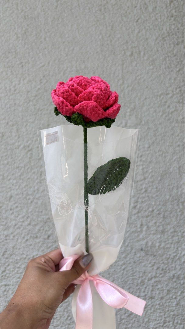 Handmade Crochet Carnation Flower Bouquet (Category: Flowers & Bouquets) located in Manila. Submitted by candygurl18 (Listing ID 1434075129, Image 2). Description: - Handmade crochet carnation flower bouquet - Features vibrant pink petals and green leaves - Wrapped in clear cellophane - Tied with a ribbon - Perfect as a gift or decorative piece - Each flower is unique and made with love.