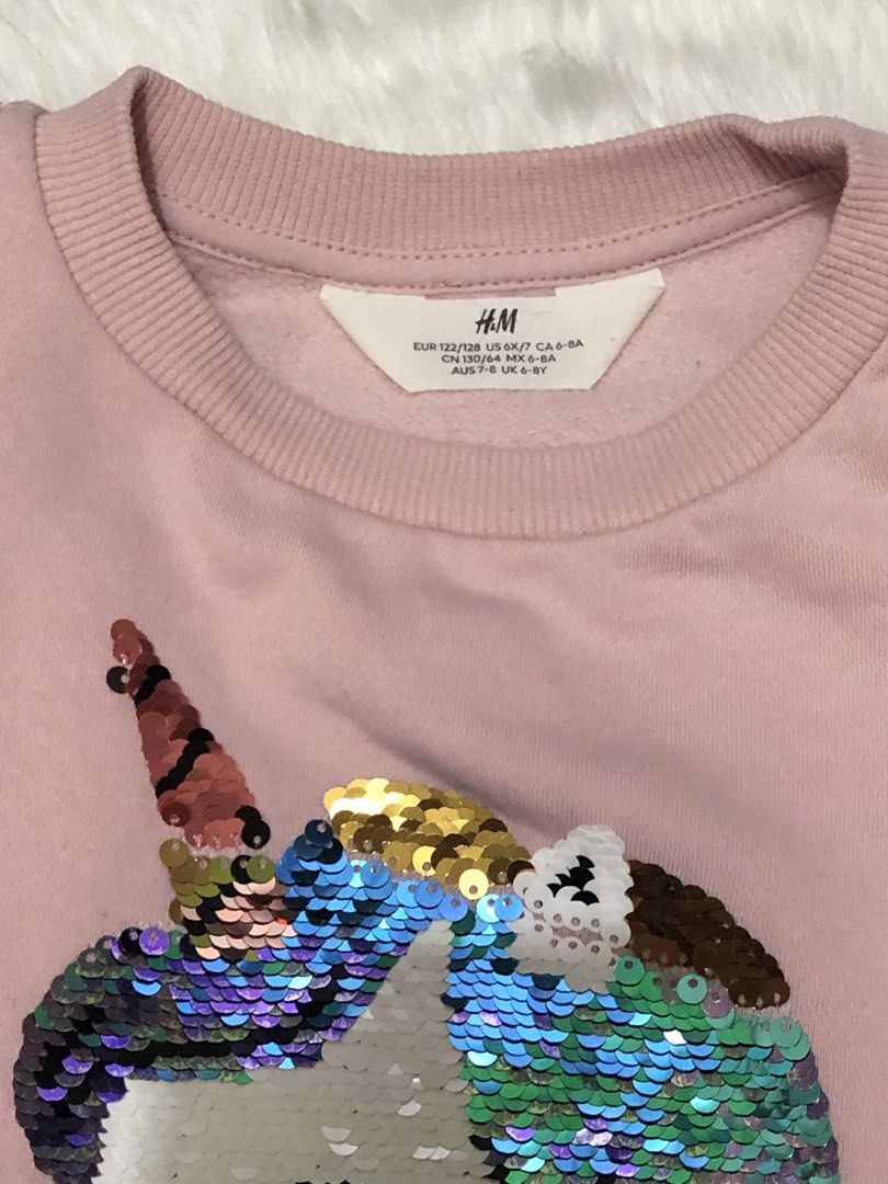 H&M Pink Unicorn Sequin Sweatshirt (Category: Babies & Kids Fashion) located in Pasig City. Submitted by trendsinstyle (Listing ID 1434136283, Image 2). Description: - H&M sweatshirt - Size: 6-8 years - Design: Unicorn with reversible sequins - Color: Light pink - Features: Crew neck, long sleeves -Lightly used.