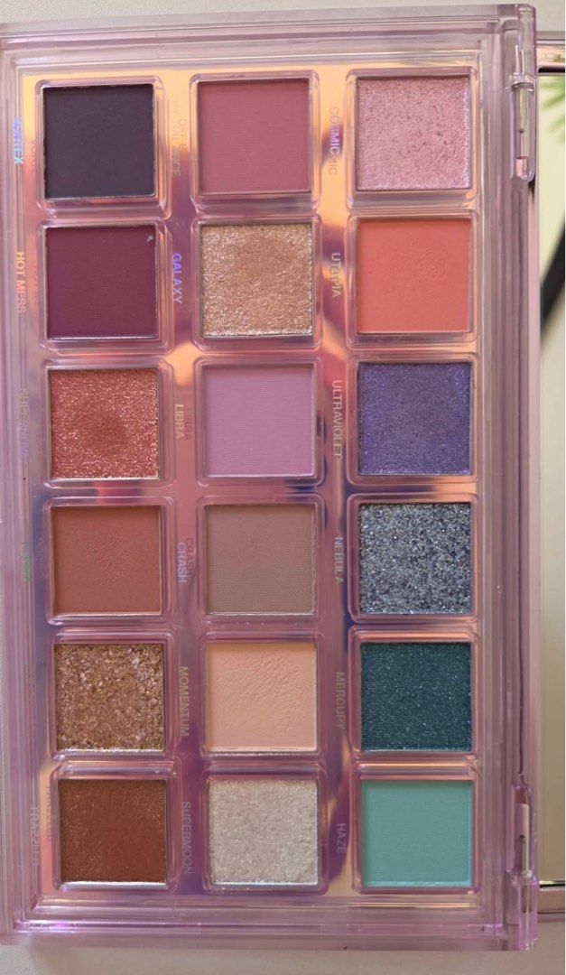 Huda Beauty Mercury Retrograde Eyeshadow Palette (Category: Makeup) located in Quezon City. Submitted by cheerupbby (Listing ID 1434144033, Image 3). Description: Features a variety of shades: light pinks, peaches, deep purples, and teals. Comes with a built-in mirror. Housed in a clear, iridescent case Stored properly and kept well. Will ship when I get back home to the Philippines in October/November 2026. I will only bring what is SOLD. Half p
