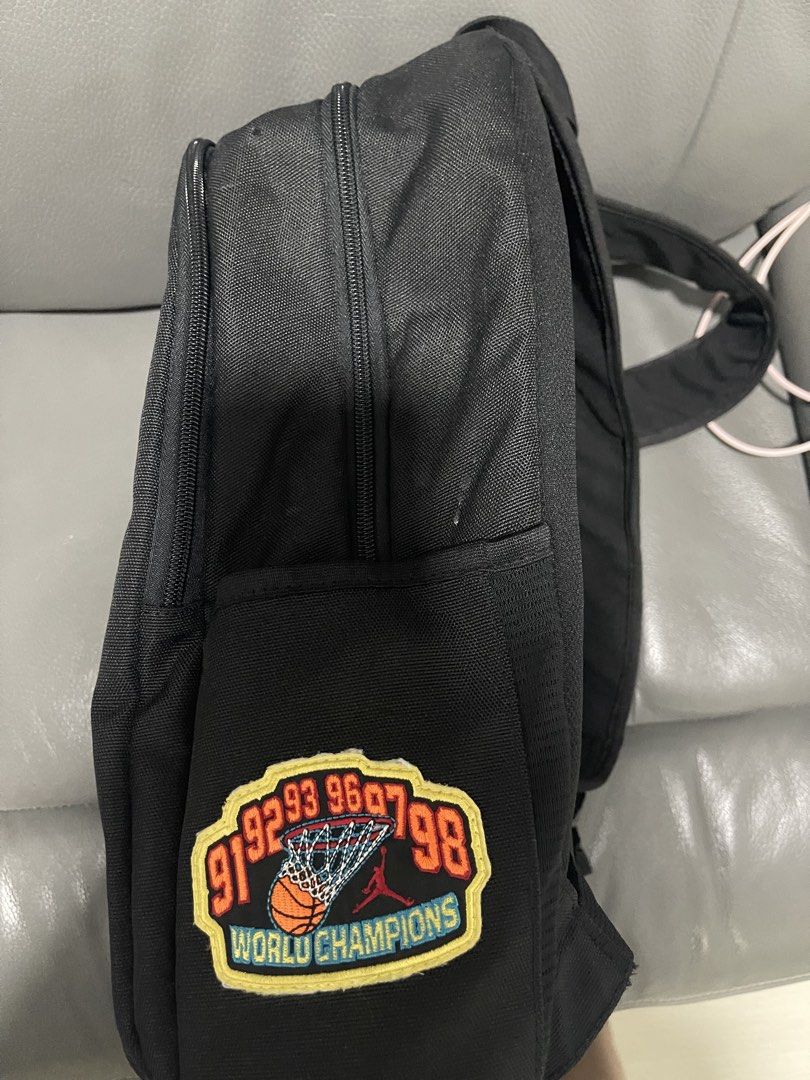 Jordan patch backpack (Category: Backpacks) located in Singapore. Submitted by milkycarou456 (Listing ID 1434122402, Image 3). Description: - Multiple compartments for organization - Includes main compartment and smaller pockets - Features Jordan branding and patches - Perfect for school or everyday use -height- 47cm -width- 40cm.