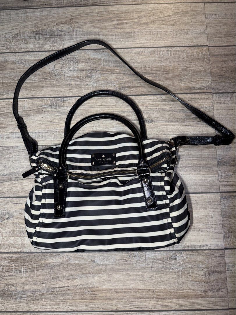 Kate Spade New York Striped Handbag (Category: Luxury Bags & Wallets) located in Imus. Submitted by badtzma (Listing ID 1434160367, Image 1). Description: Selling Kate Spade Nylon stripe leslie black/cream original bought in japan last year 2199 php slightly negotiable Slightly used No issues RFS - unloading di na nagagamit sa dami bag ni wife/ dispose na daw para magamit pa ng iba Loc: Imus/Indang MOP: Gcash/Cash/Bank Transfer MOD: Meetup/Lalamo