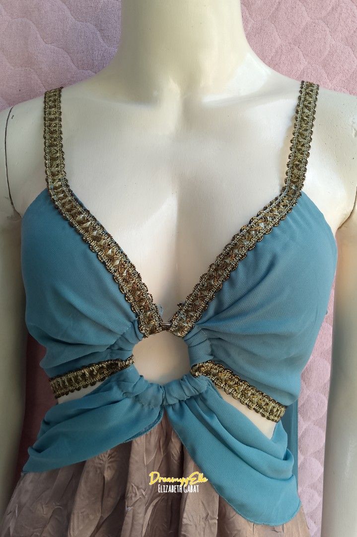 Leg Avenue Ethereal Boho Cut-Out Mini Dress (Category: Dresses) located in Bayambang. Submitted by dreamyy_elizabeth (Listing ID 1434002159, Image 3). Description: Designed with an ethereal, bohemian flair, this dress combines a dreamy teal chiffon-style bodice with a high-shine, iridescent mauve crinkle skirt. Whether you’re heading to a music festival, a summer garden party, or looking for the perfect "Fairy-core" aesthetic, this piece delivers