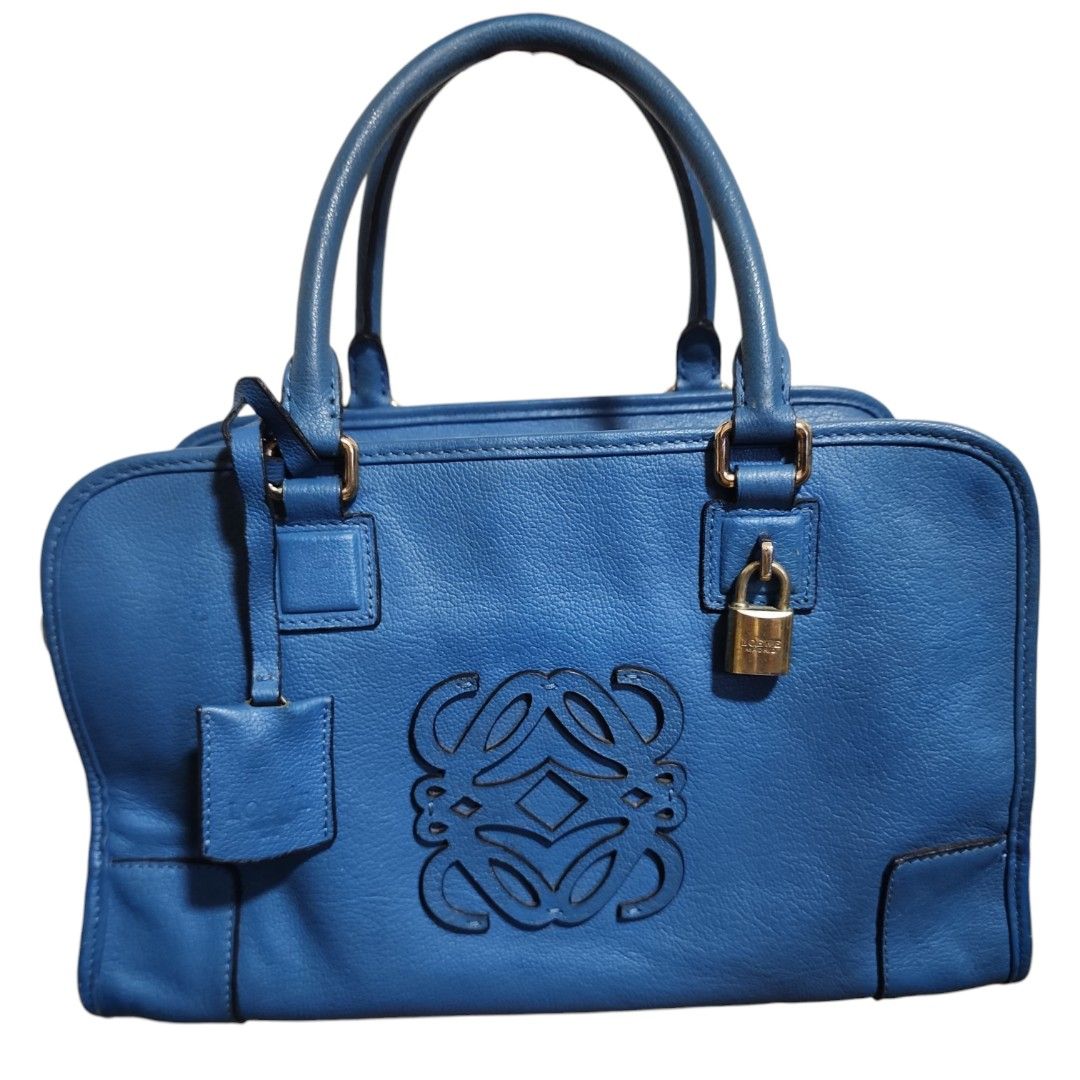 Loewe Amazona Blue Leather Handbag (Category: Luxury Bags & Wallets) located in Cavite. Submitted by appliquetrends (Listing ID 1434054427, Image 1). Description: AUTHENTIC LOEWE ALL-LEATHER AMAZONA BAG ° Made in Spain ° EEOSS You are viewing an authentic PREOWNED item, thus expect signs of usage. Item is priced based on its physical condition. Kindly manage your expectations. ° Rank: 7/10 exterior, 9/10 interior ° comes with an original Loewe Du