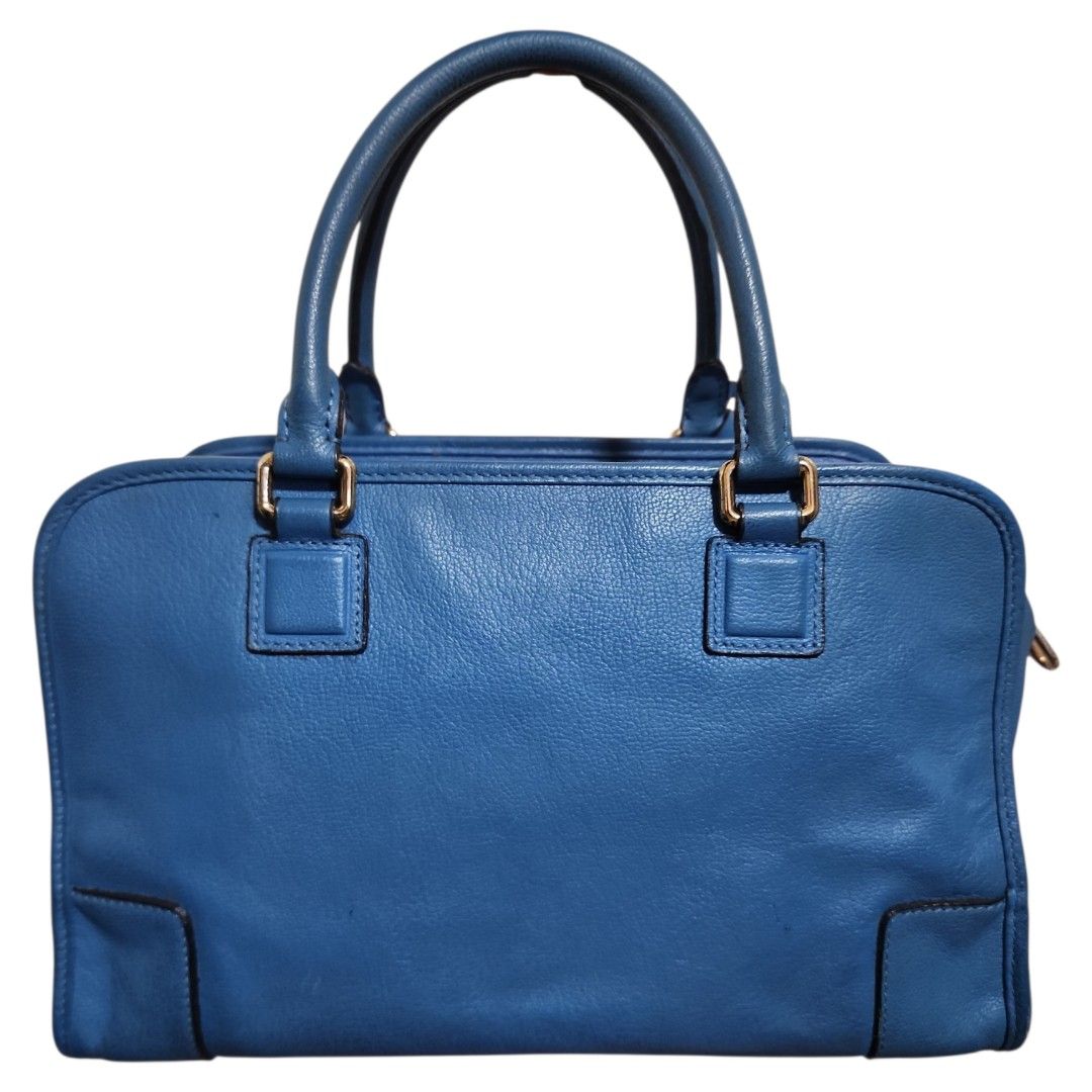 Loewe Amazona Blue Leather Handbag (Category: Luxury Bags & Wallets) located in Cavite. Submitted by appliquetrends (Listing ID 1434054427, Image 3). Description: AUTHENTIC LOEWE ALL-LEATHER AMAZONA BAG ° Made in Spain ° EEOSS You are viewing an authentic PREOWNED item, thus expect signs of usage. Item is priced based on its physical condition. Kindly manage your expectations. ° Rank: 7/10 exterior, 9/10 interior ° comes with an original Loewe Du