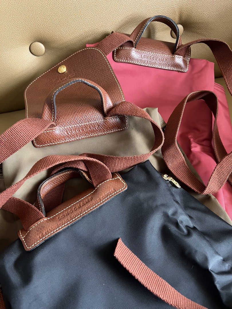 Longchamp Le Pliage backpack (Category: Luxury Bags & Wallets) located in Quezon City. Submitted by felizdoss (Listing ID 1434013720, Image 3). Description: No flaws. Used once on a trip. No flaws. RFS: decluttering Colors: black, red, green.