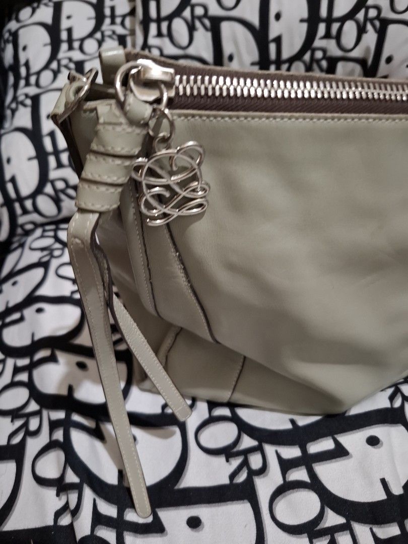 Louis Quatorze Shoulder Bag (Category: Shoulder Bags) located in Manila. Submitted by baves2002 (Listing ID 1434119019, Image 3). Description: - Light grey Louis Quatorze shoulder bag -large size - Matching strap - Secure zip closure - Spacious interior with multiple pockets - Made of leather - Features logo detail on the front - Brand name visible inside flaws: may konting line scratch sa ilalim pero hindi visible pag may laman na.