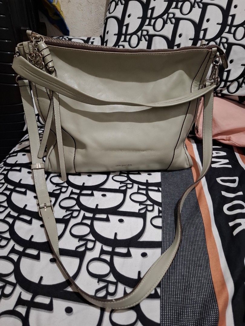 Louis Quatorze Shoulder Bag (Category: Shoulder Bags) located in Manila. Submitted by baves2002 (Listing ID 1434119019, Image 2). Description: - Light grey Louis Quatorze shoulder bag -large size - Matching strap - Secure zip closure - Spacious interior with multiple pockets - Made of leather - Features logo detail on the front - Brand name visible inside flaws: may konting line scratch sa ilalim pero hindi visible pag may laman na.