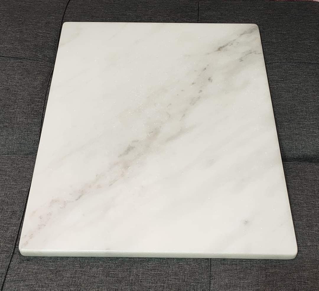 Marble Pastry Board (Category: Cookware & Accessories) located in Cainta. Submitted by marynette39 (Listing ID 1434134431, Image 1). Description: - Ideal for pastry making and serving - Smooth, cool white marble surface - Perfect for rolling out dough - Rectangular shape with gray veining - Includes non-slip rubber feet - Suitable for home and professional use -100% Marble ( makapal, mabigat) -Size: 40x50cm .