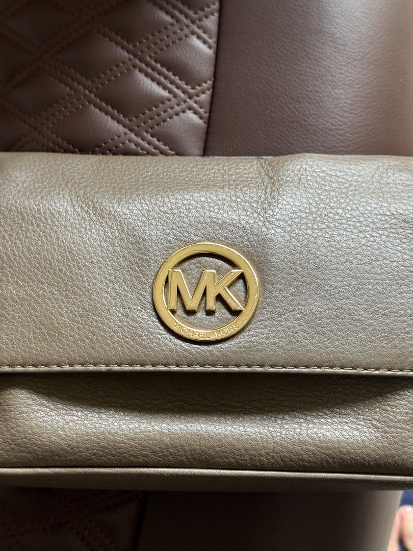 Michael Kors Fulton Flap Bag - Classic (Category: Luxury Bags & Wallets) located in Makati City. Submitted by avic_c (Listing ID 1434050661, Image 2). Description: - Authentic Michael Kors shoulder bag - Elegant two-tone design - Gold-tone chain strap - Iconic MK logo on flap closure - Branded interior lining - Includes Michael Kors tag.