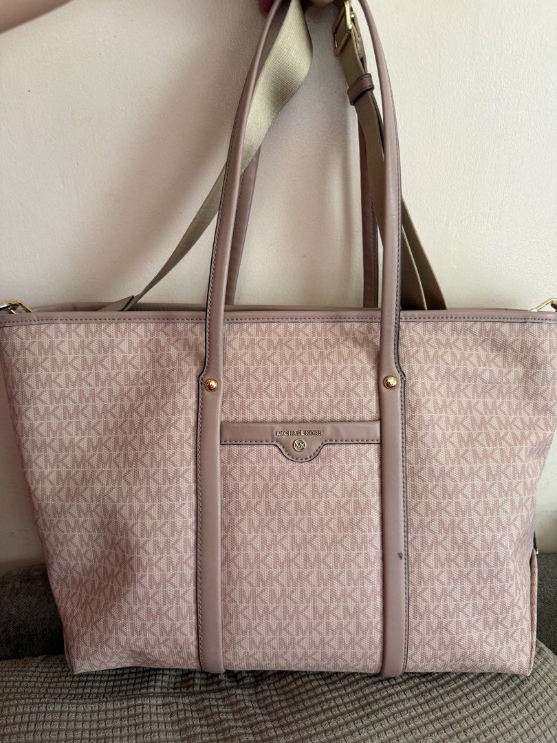 Michael Kors Tote Bag (Category: Luxury Bags & Wallets) located in Paranaque City. Submitted by aaaaa_earth (Listing ID 1434008486, Image 1). Description: - Authentic Michael Kors tote bag - Light pink MK print - Top handle and detachable shoulder strap - Front pocket with MK logo - Interior pocket - Some signs of use inside - Gold-tone hardware - Minor mark on the front.