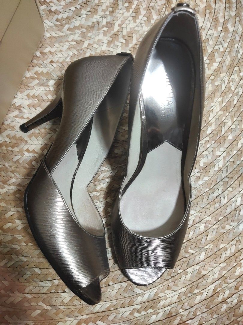 Michael Michael Kors Nathalie Open Toe Heels (Category: Heels) located in Alaminos. Submitted by adornaura (Listing ID 1434105311, Image 3). Description: - 100 percent authentic bought in Macy's -Michael Michael Kors heels - Metallic nickel finish - Open-toe design - Stiletto heel - Size 8M - Includes original box - Made of metallic leather - Adds sophistication to any outfit.