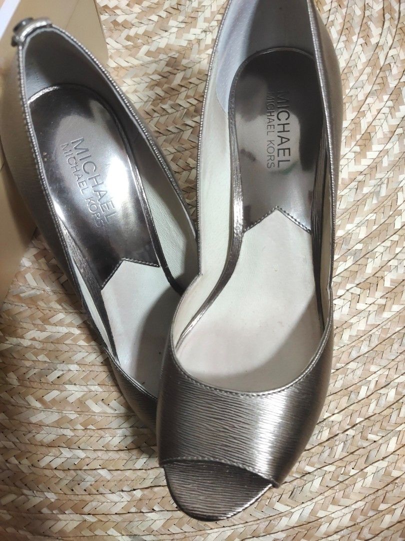 Michael Michael Kors Nathalie Open Toe Heels (Category: Heels) located in Alaminos. Submitted by adornaura (Listing ID 1434105311, Image 2). Description: - 100 percent authentic bought in Macy's -Michael Michael Kors heels - Metallic nickel finish - Open-toe design - Stiletto heel - Size 8M - Includes original box - Made of metallic leather - Adds sophistication to any outfit.