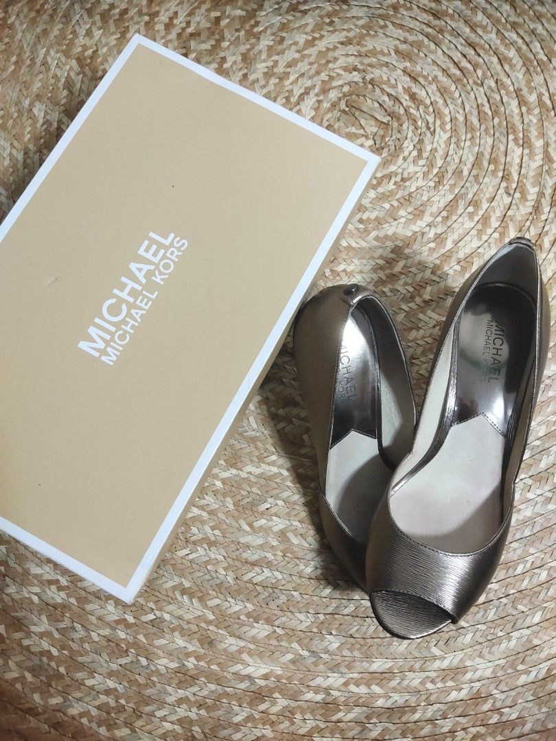Michael Michael Kors Nathalie Open Toe Heels (Category: Heels) located in Alaminos. Submitted by adornaura (Listing ID 1434105311, Image 1). Description: - 100 percent authentic bought in Macy's -Michael Michael Kors heels - Metallic nickel finish - Open-toe design - Stiletto heel - Size 8M - Includes original box - Made of metallic leather - Adds sophistication to any outfit.