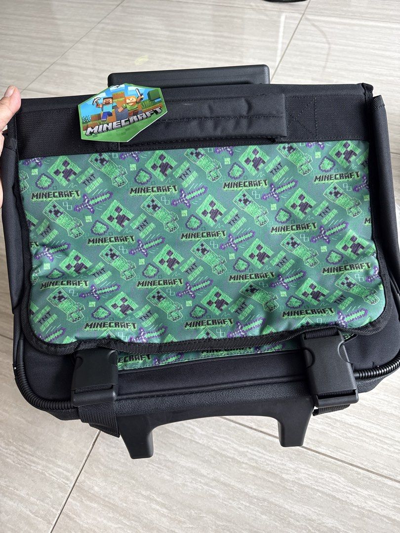 Minecraft Rolling Backpack (Category: Backpacks) located in Singapore. Submitted by yellowbloom2 (Listing ID 1434034243, Image 1). Description: - Brand new Minecraft rolling backpack - Fun Creeper and TNT design - Includes handle and wheels for easy transport - Also has backpack straps - Perfect for school or travel.