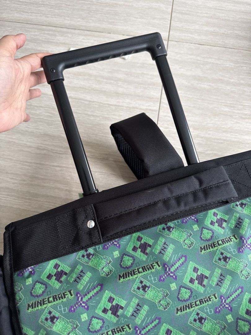 Minecraft Rolling Backpack (Category: Backpacks) located in Singapore. Submitted by yellowbloom2 (Listing ID 1434034243, Image 4). Description: - Brand new Minecraft rolling backpack - Fun Creeper and TNT design - Includes handle and wheels for easy transport - Also has backpack straps - Perfect for school or travel.