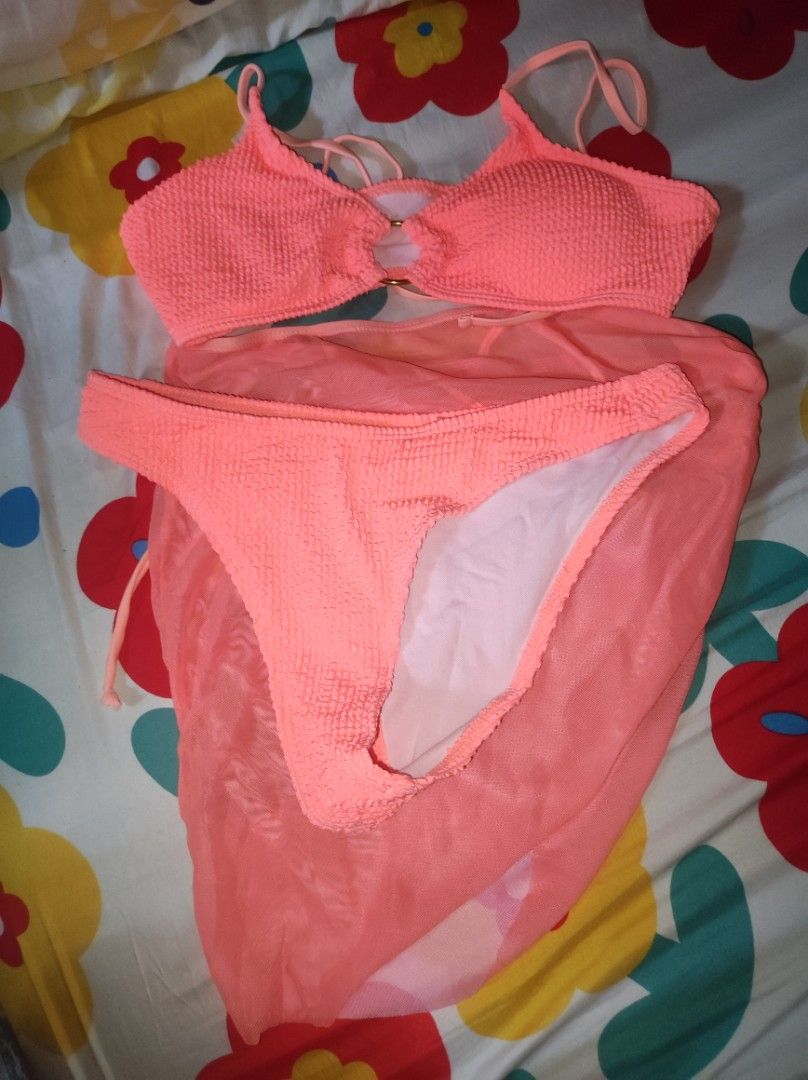 Neon Orange 3 in 1 Swimsuit (Category: Bikinis & Swimsuits) located in Caloocan City. Submitted by ibgdnn (Listing ID 1434017071, Image 1). Description: - bikini set - Textured coral fabric - Halter neck top with ring detail - Includes matching bottom - see through skirt.
