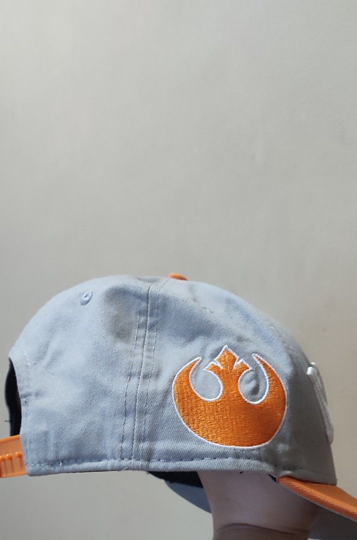 New Era Rebel Cap (Category: Caps & Hats) located in Mandaluyong City. Submitted by fml111213 (Listing ID 1433992778, Image 2). Description: - New Era 9Fifty cap - Features "REBEL" on the front - Rebel Alliance symbol on the side - Grey crown - Orange brim.