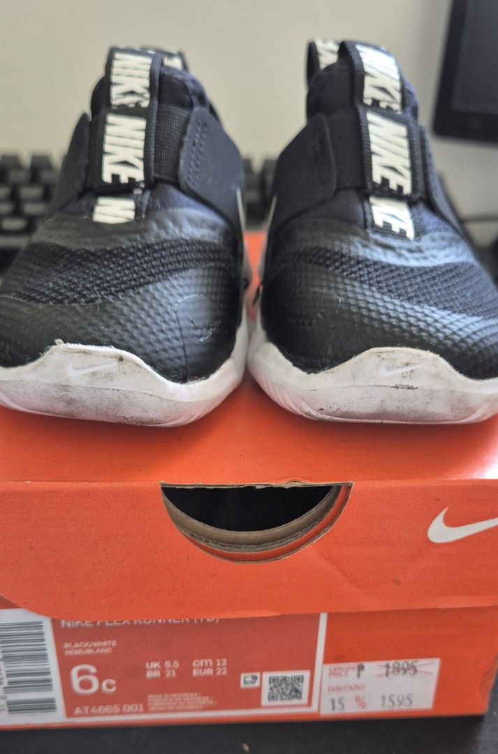 Nike Flex Runner Baby Shoes Black (Category: Babies & Kids Fashion) located in Pasig City. Submitted by mamaconcep (Listing ID 1434086907, Image 3). Description: - Nike Flex Runner baby shoes - Color: Black - Size: 6C - Design: Slip-on - Upper: Mesh - Soles: White - Features Nike logo - Condition: Soles show wear.
