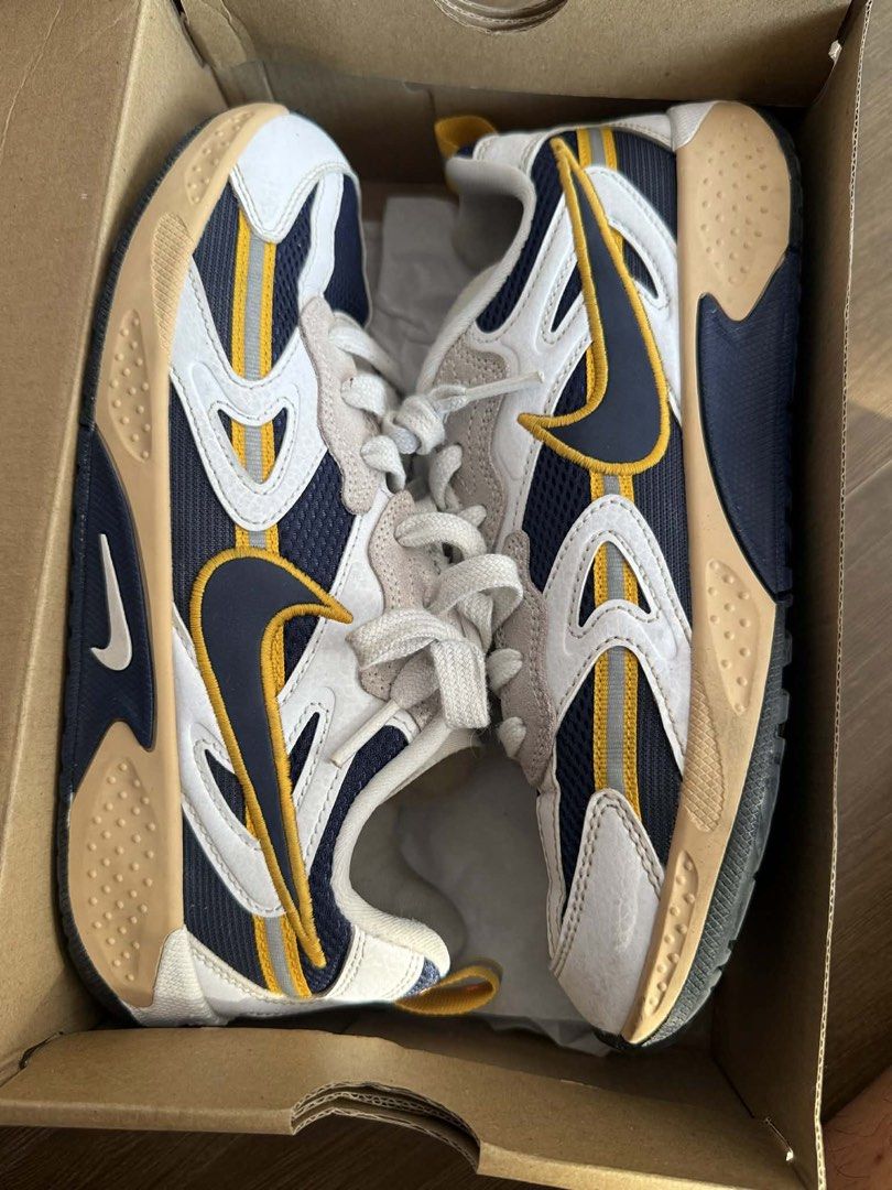 Nike JAM Sneakers (Category: Sneakers) located in Manila. Submitted by aeronvsbbf (Listing ID 1434006859, Image 1). Description: - Stylish Nike sneakers - Unique design with white, navy blue, and yellow accents - Light brown soles - Comes with original box (hindi ko lang na-pic, pero will provide it to u) -Size W-8 M-6.5 - Never been worn, never been used ever - Original 💯.