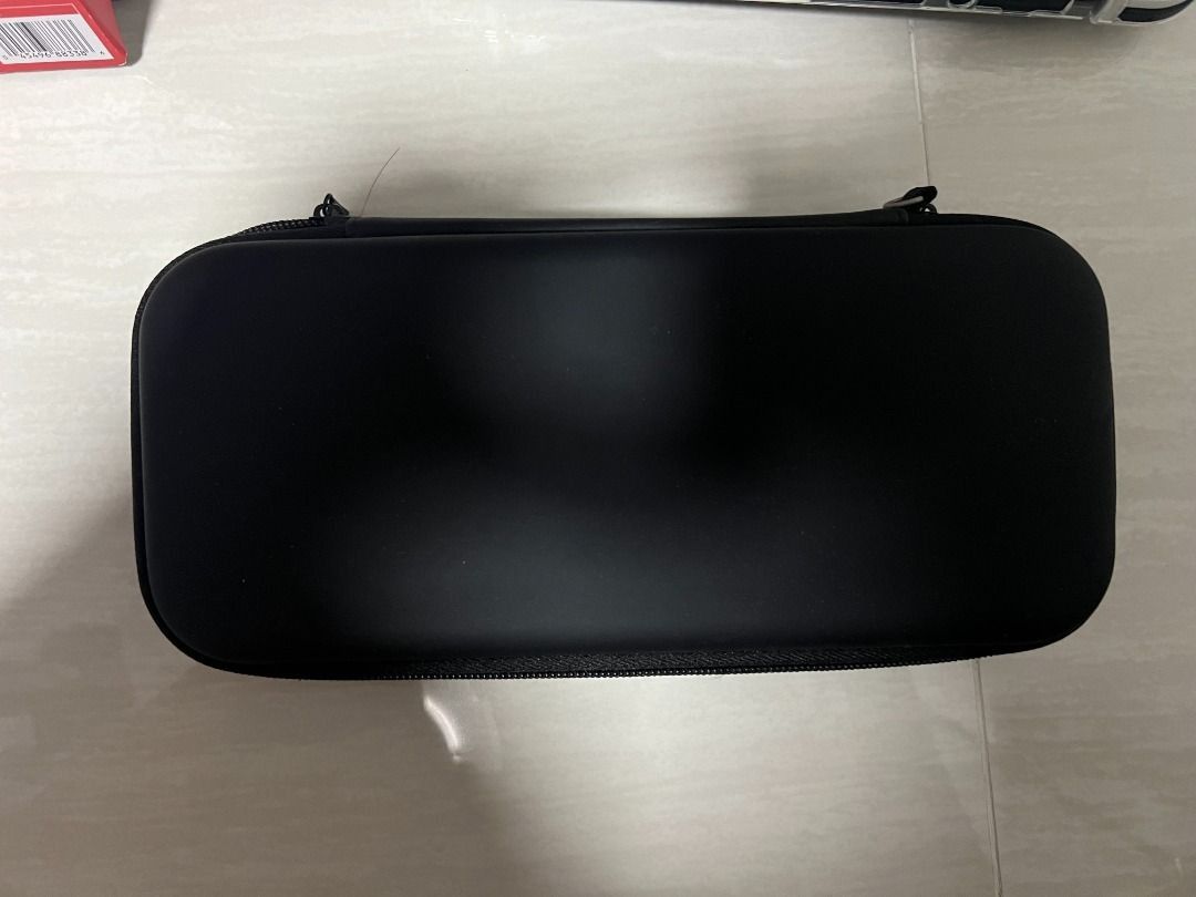 Nintendo Switch OLED Model - White (Category: Nintendo) located in Singapore. Submitted by dnias (Listing ID 1434135607, Image 2). Description: Including everything that comes in the box. Screen has a screen protector on since day 1. Also throwing in a plastic cover for the switch and also a hard carrier cover. Meet up at my place only..