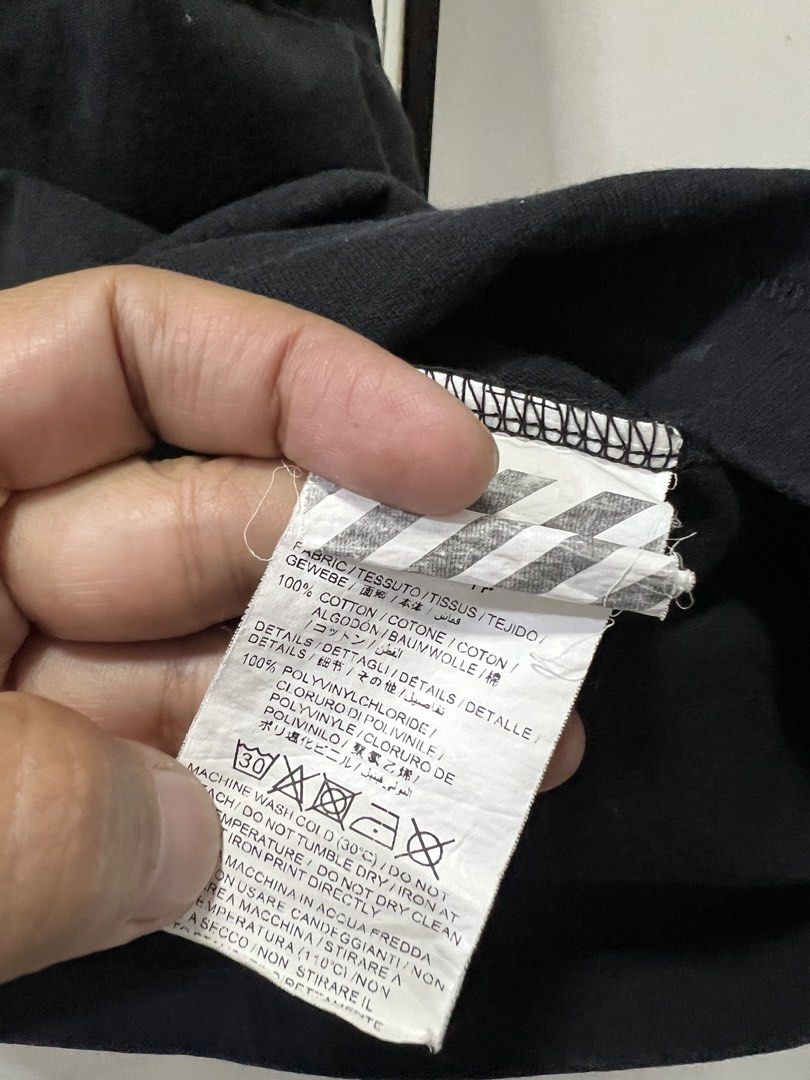 Off-White Black T-Shirt (Category: Tshirts & Polo Shirts ) located in Meycauayan. Submitted by 3fold (Listing ID 1434020818, Image 3). Description: - Off-White black t-shirt - "OFF" print on the front - Graphic print on the back with yellow accents - Crew neck and short sleeves - From the Spring/Summer 2018 collection - Made in Portugal - 27x23 dimes.